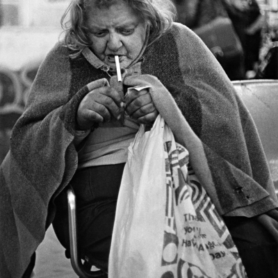 Bag Lady Lighting Cigarette, Times Square Station